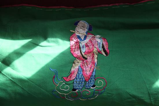 A Chinese green fabric banner panel, early 20th century, 54 x 380cm